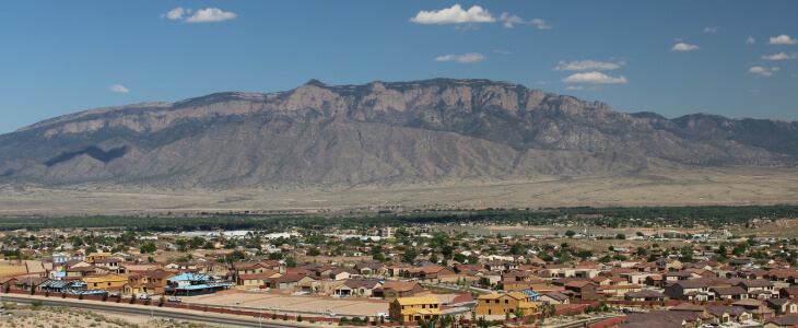 View of Sandia Mountain with the expanding sprawl of Albuquerque's suburb of Rio Rancho in the foreground.
