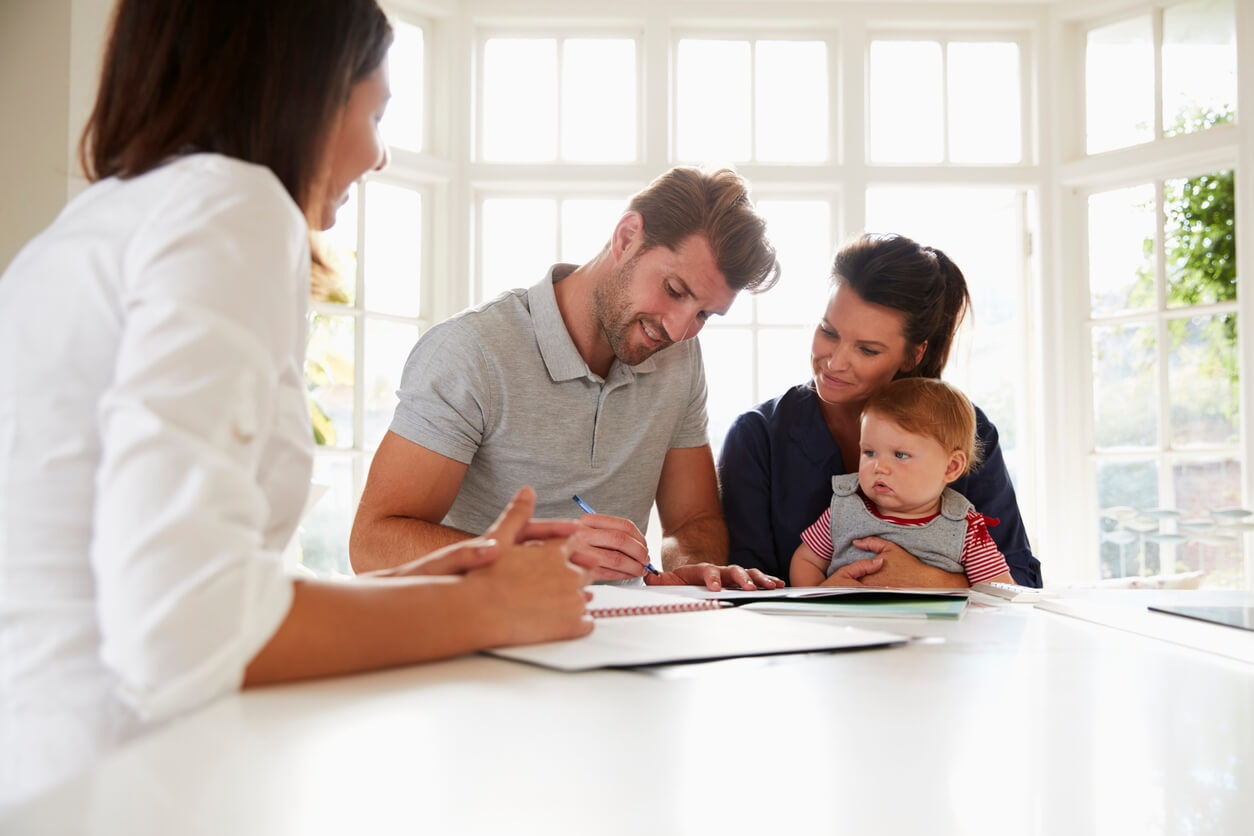 divorced parents with child signing agreement for legal custody