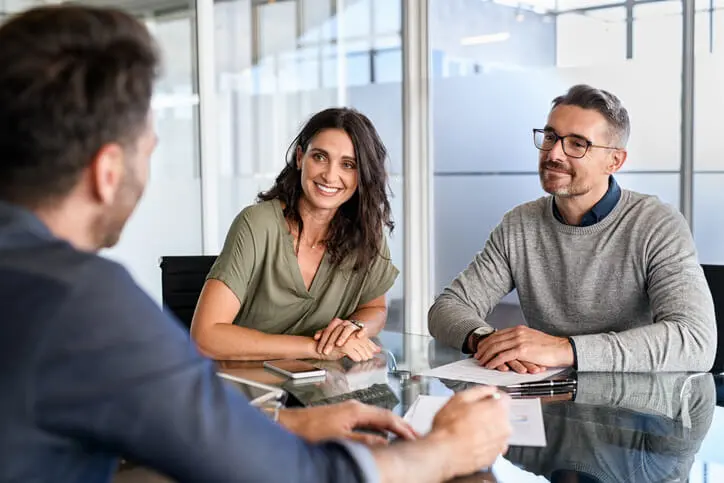 couple meeting with family law attorney