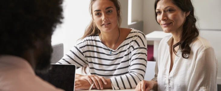 mother and daughter meeting with family law attorney